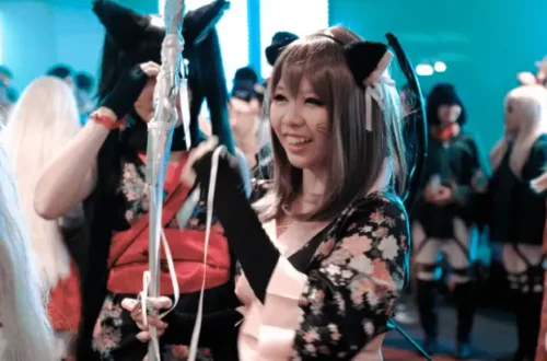 Girl in Japanese kawaii cosplay with cat ears and kimono-inspired costume