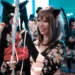 Girl in Japanese kawaii cosplay with cat ears and kimono-inspired costume
