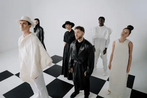 Group of people showcasing various fashion aesthetics in black and white