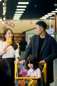 Family shopping together in a supermarket, enjoying quality time.