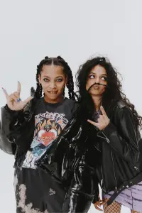 Bold punk aesthetic captured with models wearing oversized jackets and band tees