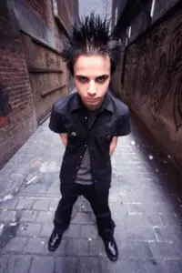 Contemporary emo fashion trends displaying alternative style elements and dark aesthetic in atmospheric street setting